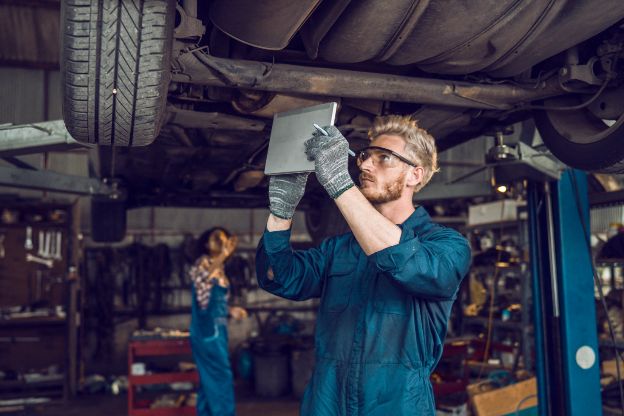 Service rep working on car