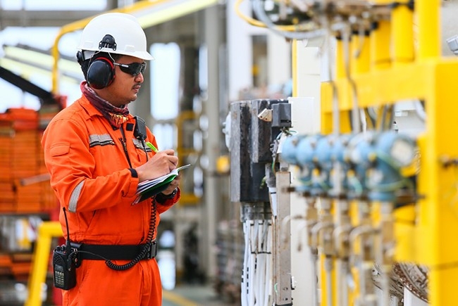 A Better Way to Maintain Your Equipment man doing maintenance on equipment