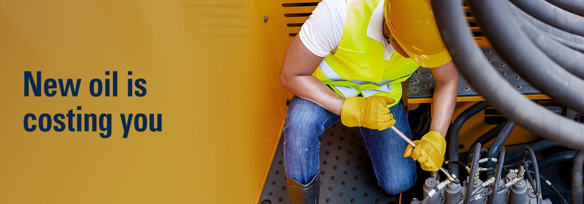 New oil is costing you Man working on machinery