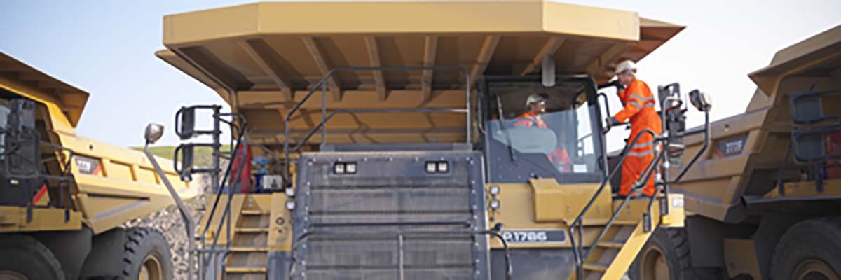 Warranty plus Men on heavy equipment